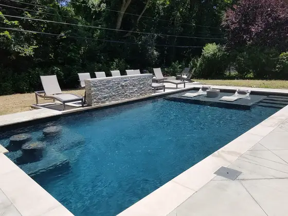 Finished vinyl-style in-ground pool build by Mud Slingers